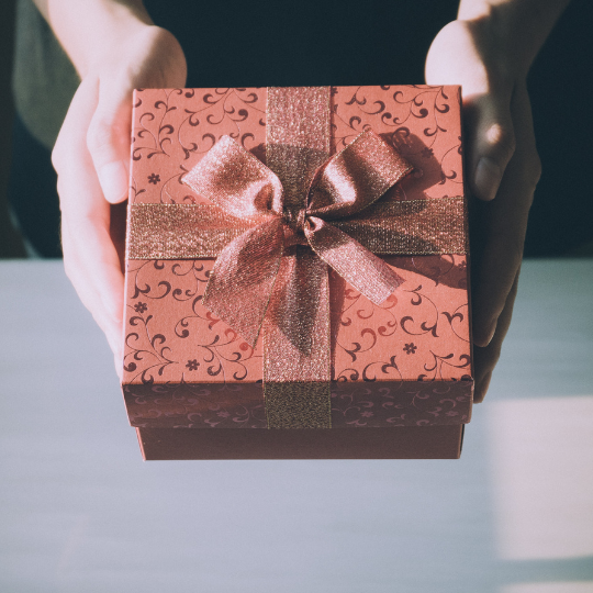 Red gift box with a bow